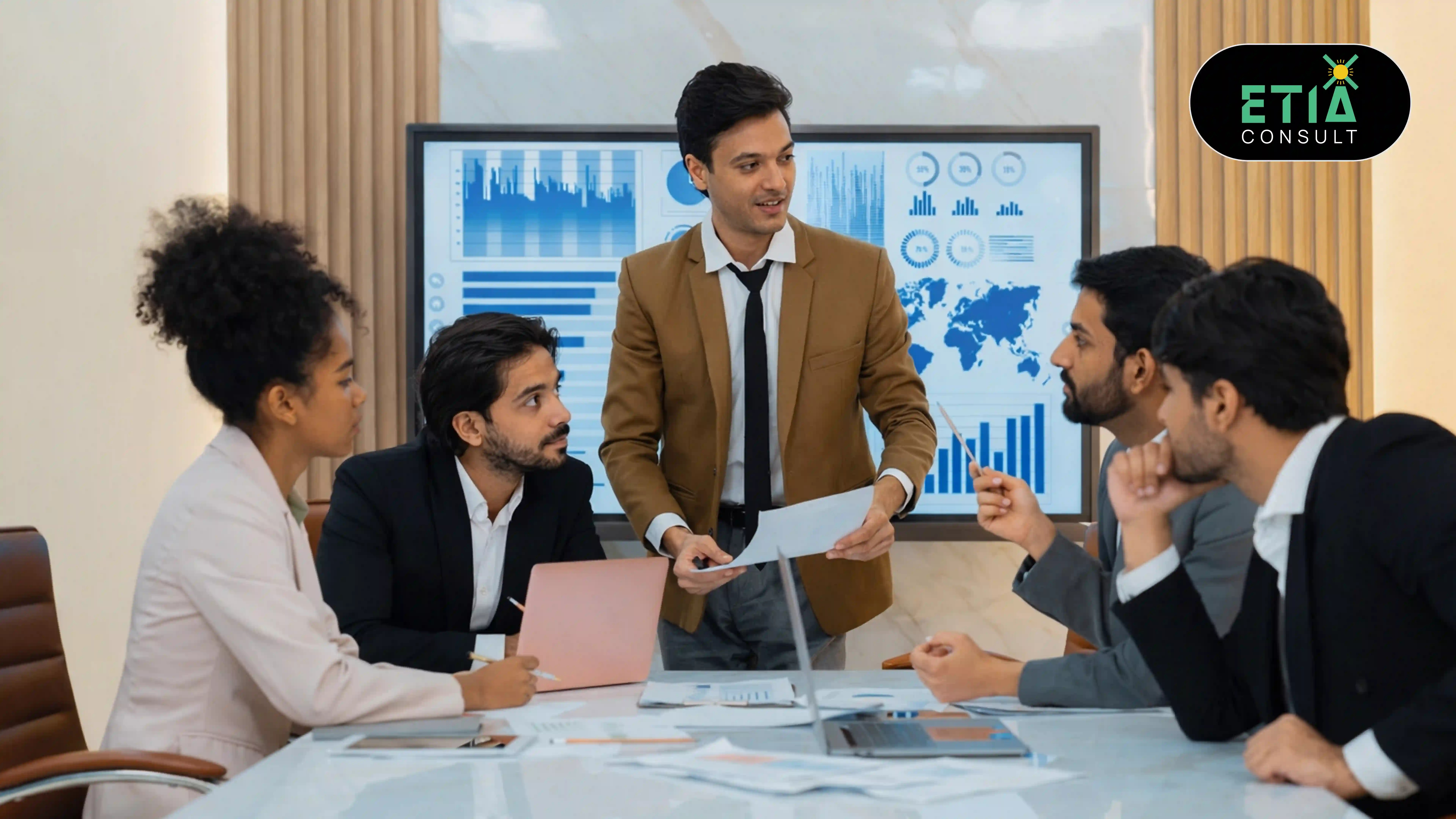 Digital transformation consultant reviewing enterprise technology integration and data-driven insights on a laptop